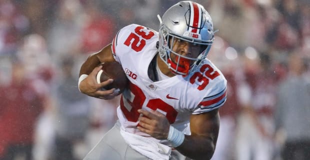 Ohio State Buckeyes running back TreVeyon Henderson on a carry during a college football game in the Big Ten.